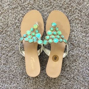 These are thong sandals with a wedged heel.